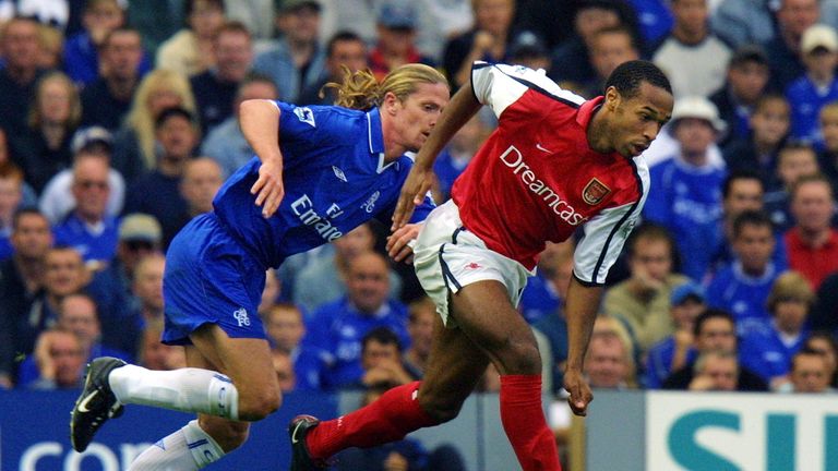 Chelsea's Petit (L) gives chase to Arsenal's Thierry Henry at Stamford Bridge in March 2003