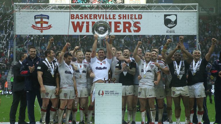 England celebrate with the Baskerville Shield after beating New Zealand at the DW Stadium