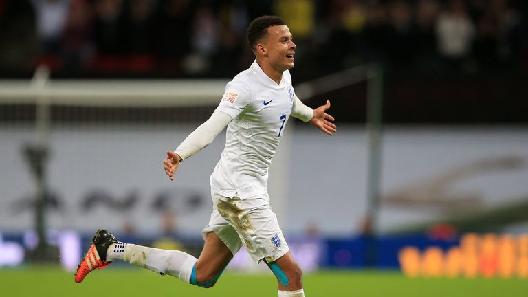 England's Dele Alli celebrates scoring his side's first goal during the international friendly match at Wembley Stadium, London.