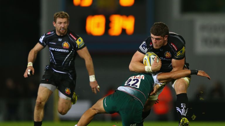 Exeter's Dave Ewers (R) powers past Leicester's Peter Betham 