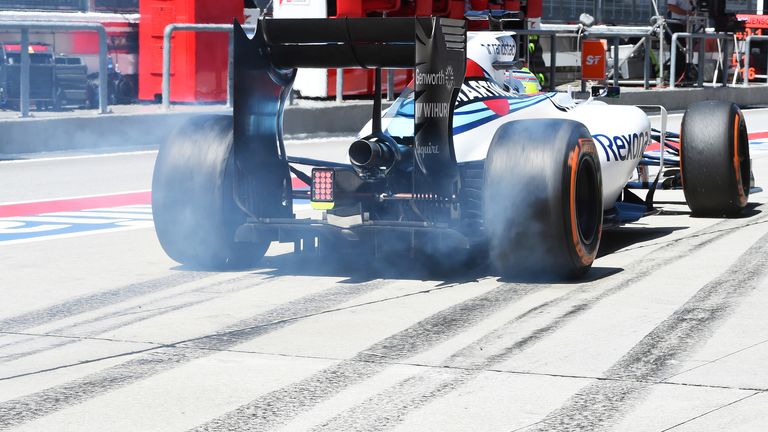 Laying rubber: Felipe Massa smokes his tyres during practice for the Malaysia GP - Picture by Sutton Images