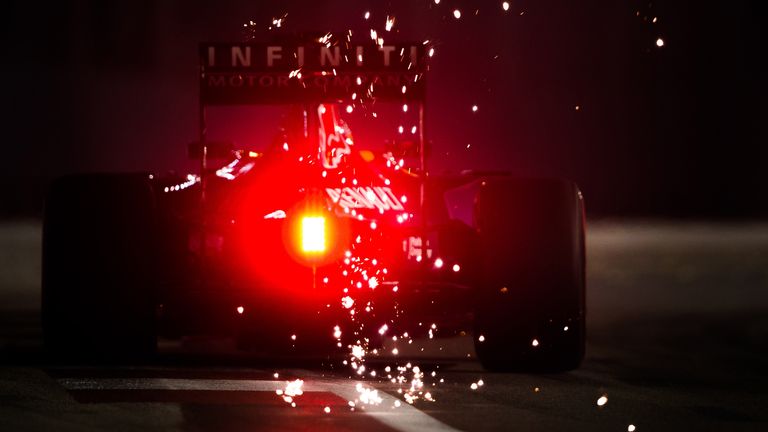 Out of darkness: A shower of sparks are thrown up by Daniel Ricciardo's Red Bull in Singapore - Picture by Daniel Kalisz, Sutton Images