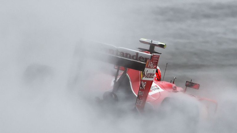 There's a car out: A wall of spray envelops Kimi Raikkonen's Ferrari during practice for the US GP - Lars Baron Quia, Getty Images