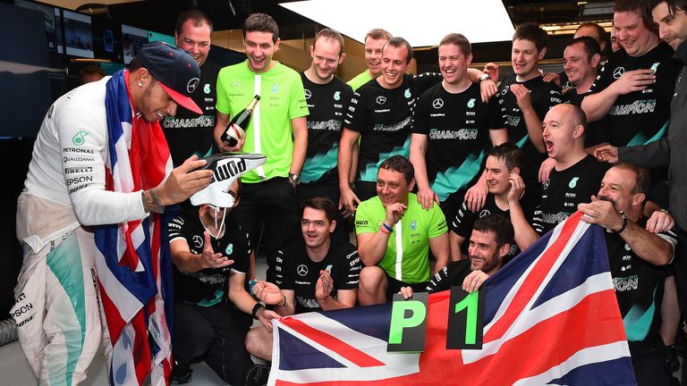Just done it: Lewis Hamilton celebrates with his pit crew after clinching his third world title - Picture by Keith Sutton, Sutton Images