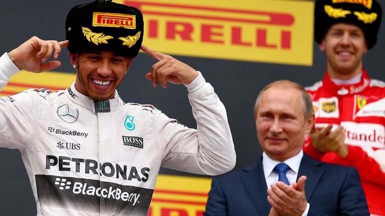 The main man: Sebastian Vettel and Vladimir Putin applaud Lewis Hamilton as he celebrates winning the Russian GP - Picture by  Dan Istitene, Getty Images