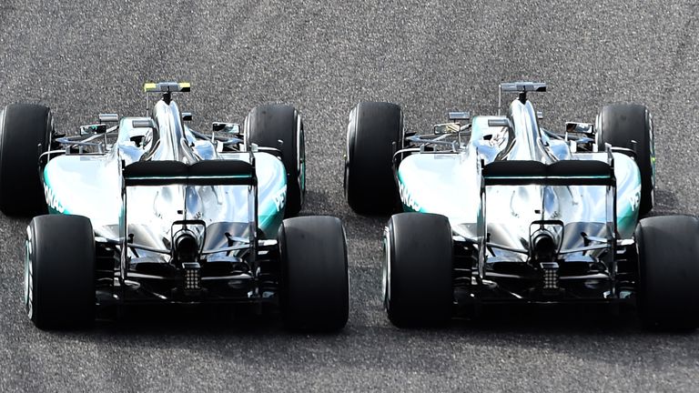 Getting ahead: Lewis Hamilton out-muscles Nico Rosberg on the opening lap of the Japanese GP - Picture by Dan Istitene, Sutton Images
