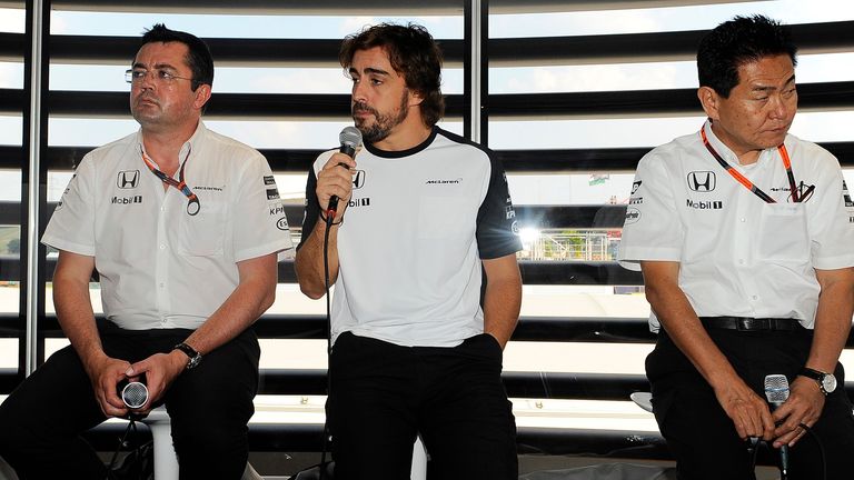 Feeling the strain: Eric Boullier, Alonso and and Yasuhisa Arai try to explain McLaren-Honda's struggles in Budapest - Picture by Sutton Images