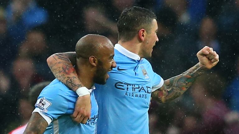 Fabian Delph (2nd L) of Manchester City celebrates scoring his team's second goal 