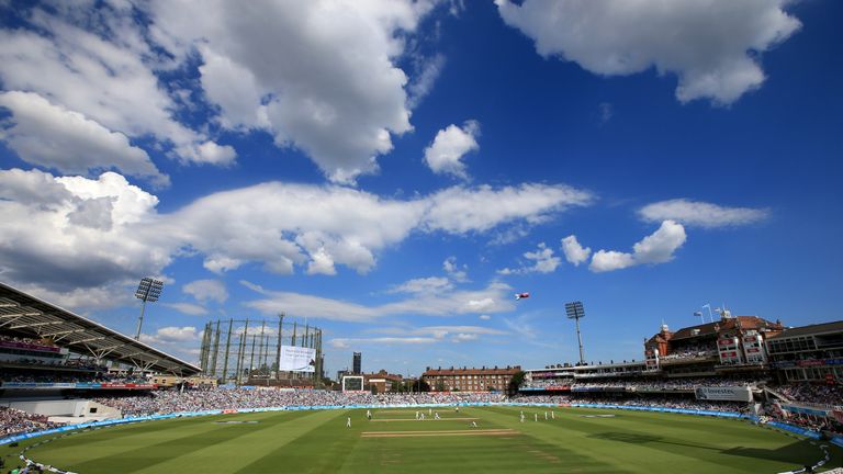 Fans watch the action during the Ashes Test between England and Australia at The Oval