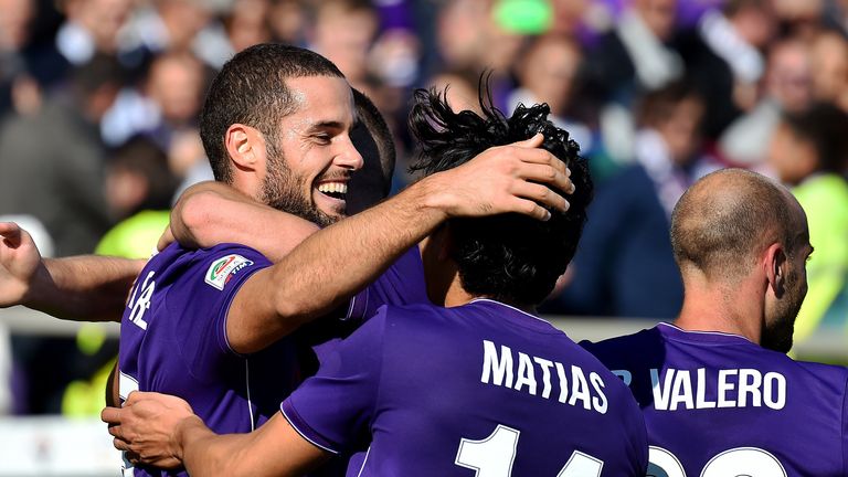 Fiorentina's Mario Suarez (left) celebrates