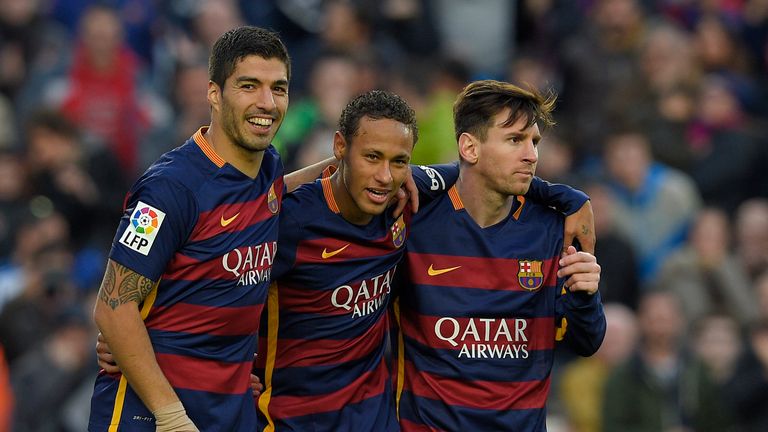 Neymar (C) celebrates with Barcelona forward Luis Suarez (L) and Lionel Messi (R)