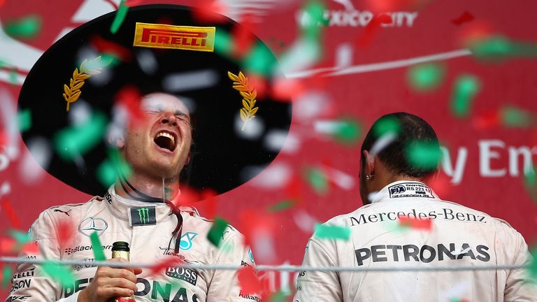 MEXICO CITY, MEXICO - NOVEMBER 01:  Nico Rosberg of Germany and Mercedes GP celebrates on the podium next to Lewis Hamilton of Great Britain and Mercedes G