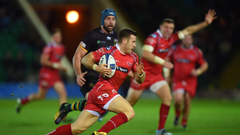Gareth Davies of Scarlets cuts through the Northampton defence to score his team's opening try