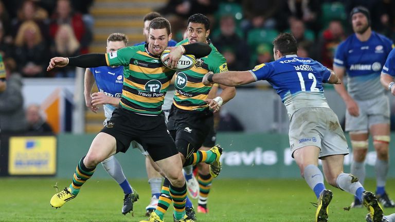  George North of Northampton moves past Brad Barritt during the Aviva Premiership match against Saracens