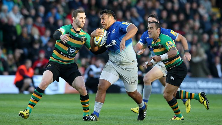 Mako Vunipola of Saracens tries to evade Northampton's George North