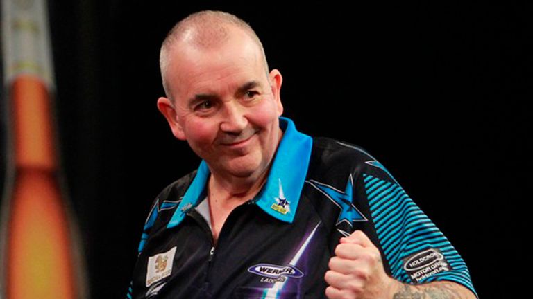 Phil Taylor celebrates winning his Grand Slam of Darts quarter-final (Pic: Lawrence Lustig)