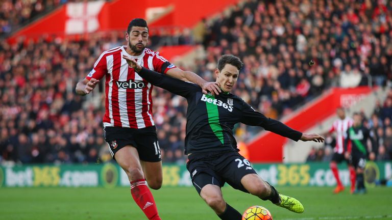 Graziano Pelle of Southampton and Philipp Wollscheid of Stoke City compete for the ball 