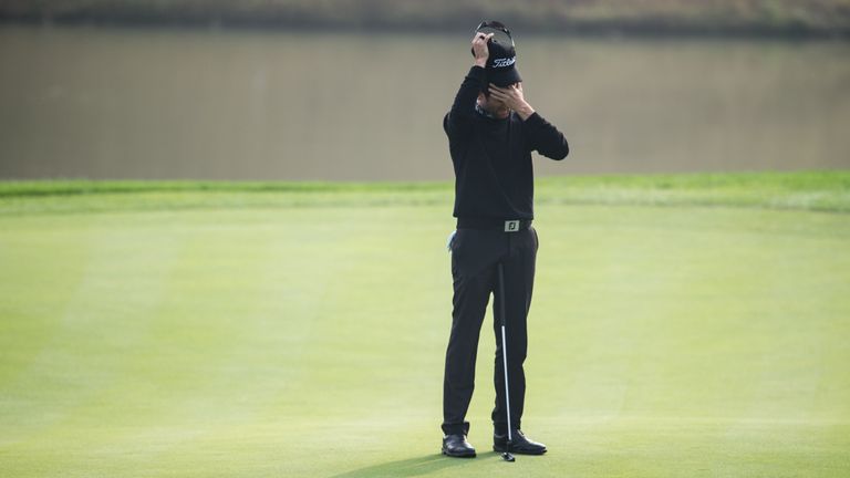 Gregory Bourdy struggles to contain his emotions on the 18th green at the BMW Masters
