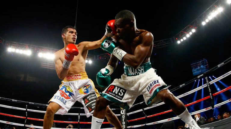 Drian Francisco throws a left to the head of Guillermo Rigondeaux during their junior featherweight bout at the Mandal