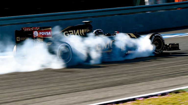 Smoking hot: Romain Grosjean locks up his Lotus car during testing - Picture by Mark Sutton, Sutton Images