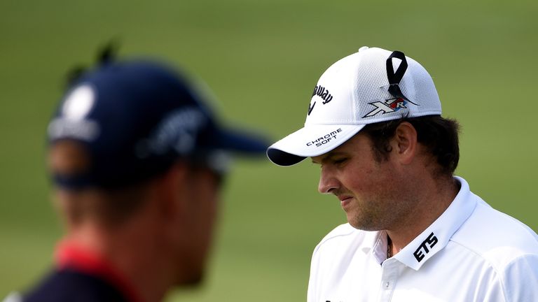 SHANGHAI, CHINA - NOVEMBER 14:  Henrik Stenson of Sweden and Patrick Reed of the United States with black ribbons in their caps as a mark of respect for th