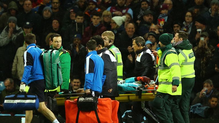 Watford goalkeeper Heurelho Gomes is stretchered off during the game at Aston Villa 