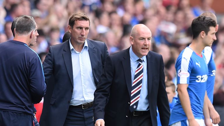 Rangers manager Mark Warburton (second right) insists he has no issue with Hibs' Allan Stubbs (second left)