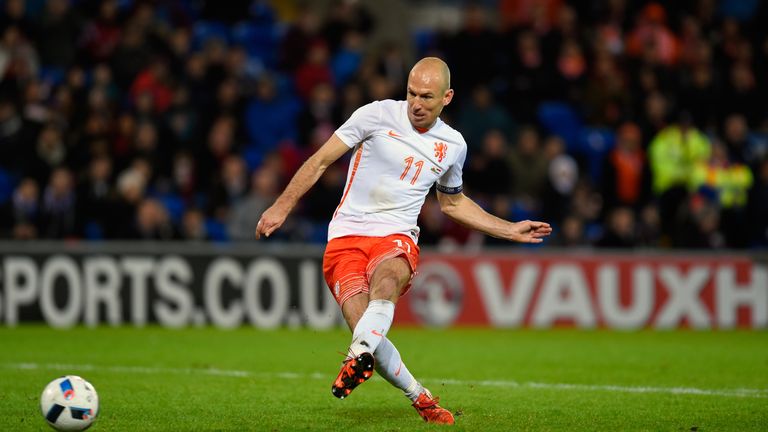 Netherlands players Arjen Robben scores the third Dutch goal against Wales