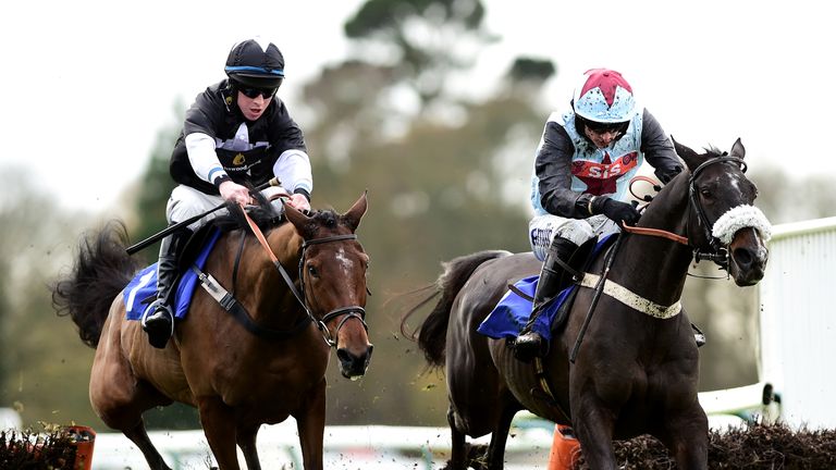 Clondaw Cian ridden by Tom O'Brien (right) wins the Patrick Your 2 Weeks Late Murphy Novices' Hurdle at Fontwell from Bigmartre.
