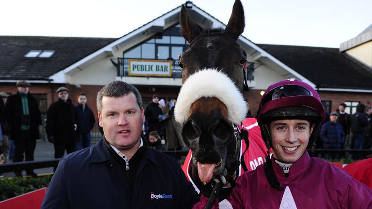 Bryan Cooper celebrates with No More Heroes and trainer Gordon Elliott after winning the Bar One Racing Drinmore Novice Chase.