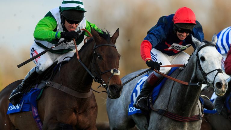 Rock on Ruby, (far left) ridden by Barry Geraghty pushes for the line after jumping the final fence on the way to winning The Coral Hurdle during the Novem