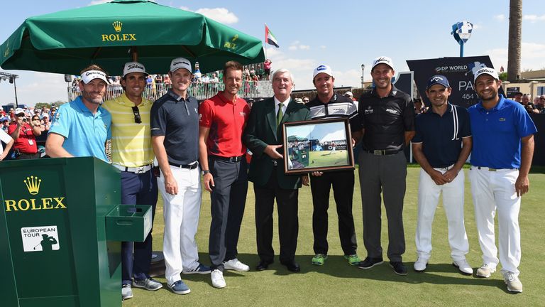 On the tee: Ivor Robson (centre) with a number of Tour players in Dubai on Sunday