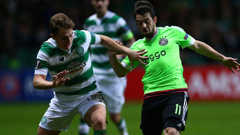 GLASGOW, SCOTLAND - NOVEMBER 26:  James Forrest of Celtic challenges Amin Younes of Ajax during the UEFA Europa League Group A match between Celtic FC and 