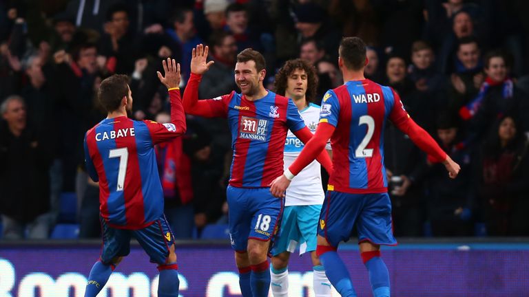 LONDON, ENGLAND - NOVEMBER 28: James McArthur (C) of Crystal Palace celebrates scoring his team's first goal with his team mates Yohan Cabaye (L) and Joel 