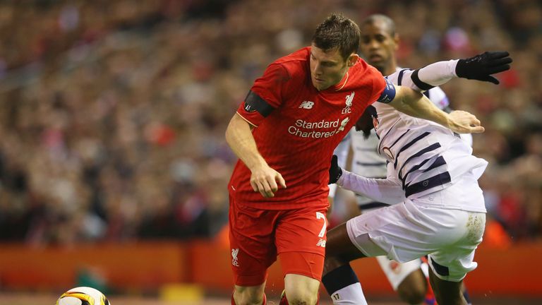 James Milner of Liverpool holds off Andre Biyogo Poko of Bordeaux during the UEFA Europa League Group B match at Anfield