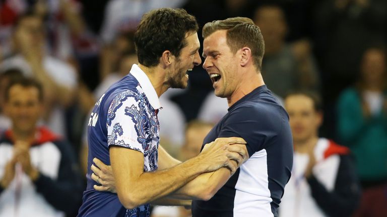 James Ward celebrates with team captain Leon Smith after winning his singles match against John Isner. 