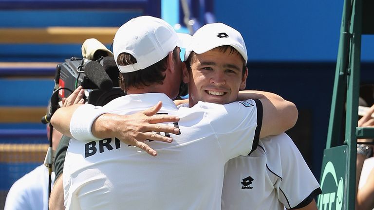 Great Britain captain Leon Smith hugs Jamie Baker during their Davis Cup win over Turkey in 2010