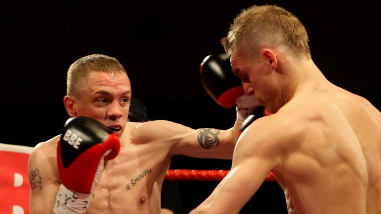 Jason Booth (left) on top against Mark Moran (right) during the Super-bantamweight vacant British Title