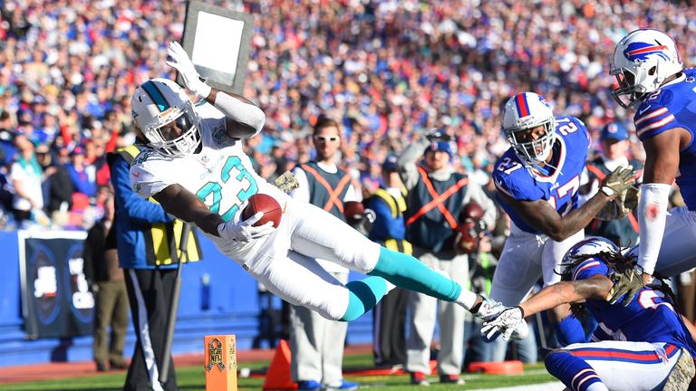 Jay Ajayi of the Miami Dolphins comes up short of a touchdown against the Buffalo Bills on his debut