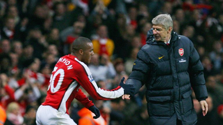 Simpson is congratulated by Arsene Wenger after scoring against in a 3-0 win over Wigan in 2008