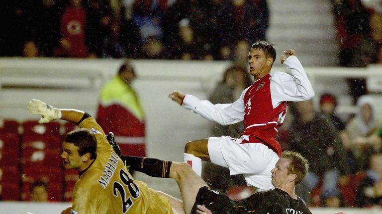 Jeremie Aliadiere of Arsenal scores the first goal during the Carling Cup fourth round match between Arsenal and Wolves