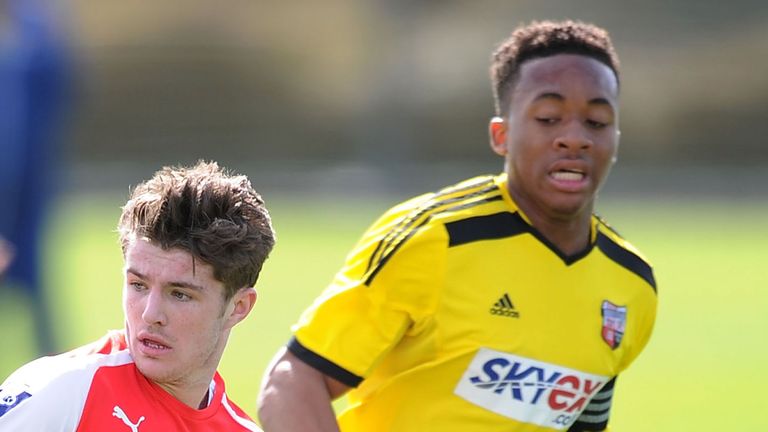 Dan Crowley of Arsenal breaks past Jermaine Udumaga of Brentford (right)