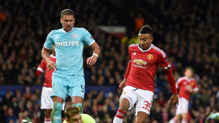 PSV Eindhoven goalkeeper Jeroen Zoet saves at the feet of Manchester United's Jesse Lingard