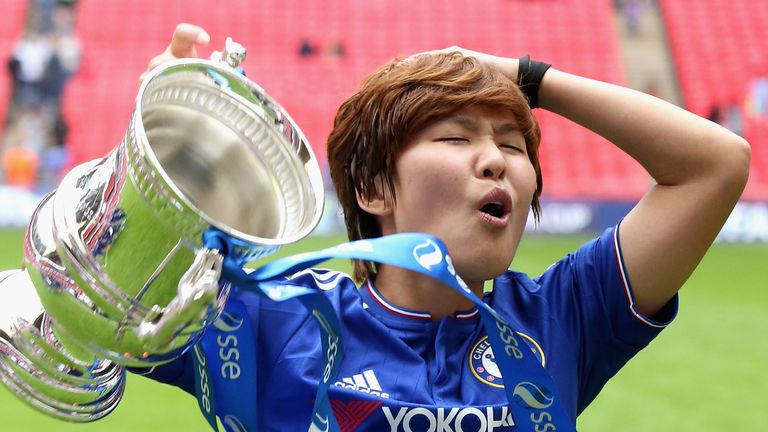 Ji So-Yun celebrates with FA Cup trophy