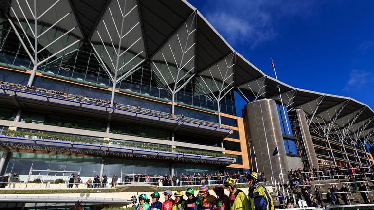 The jockeys at Ascot observe a minutes silence before the start of racing for the terrorist attacks in Paris