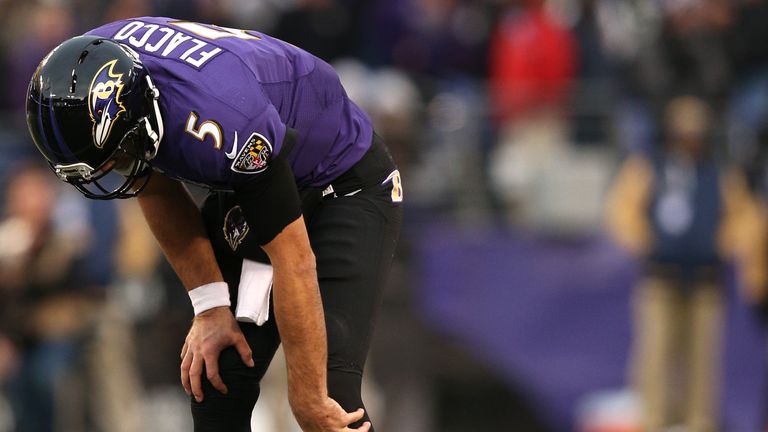 BALTIMORE, MD - NOVEMBER 22: Quarterback Joe Flacco #5 of the Baltimore Ravens winces in pain on the final drive of the fourth quarter against the St. Loui
