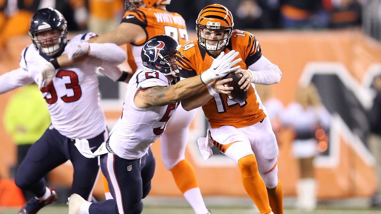 John Simon of the Houston Texans tackles Andy Dalton of the Cincinnati Bengals