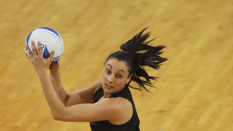 DELHI, INDIA - OCTOBER 04:  Joline Henry of New Zealand catches and looks to pass during the preliminary round group B netball match between New Zealand an