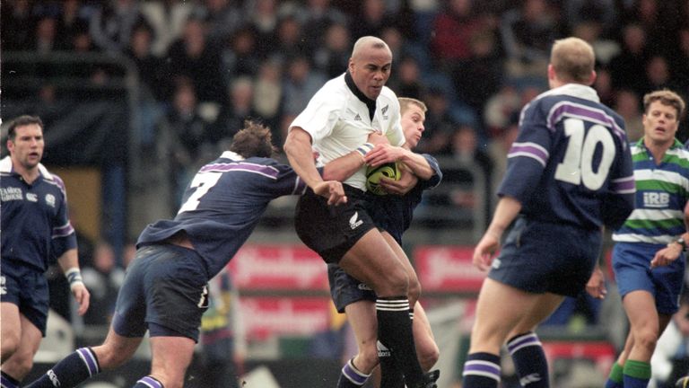Jonah Lomu  is tackled by Scotland's Martin Leslie and Chris Paterson in 200o