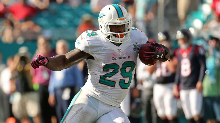 MIAMI GARDENS, FL - OCTOBER 25: Jonas Gray #29 of the Miami Dolphins rushes during a game against the Houston Texans at Sun Life Stadium on October 25, 201